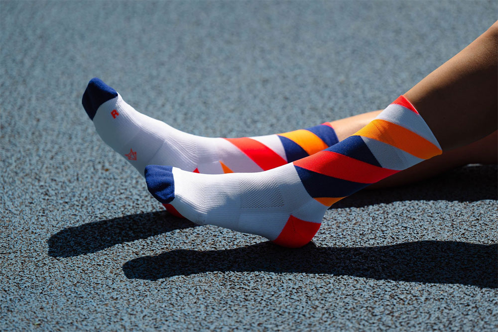 incylence-running-socks-high-cut-loops-white-orange-inferno-3.jpg