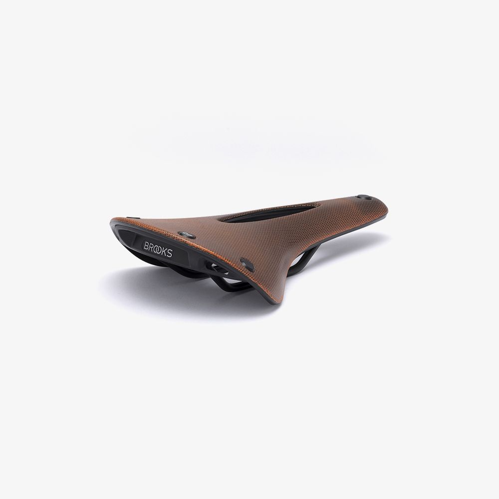c17_carved_orange_cambium_saddle_3-4.jpg